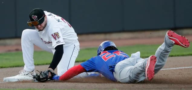 Wisconsin Timber Rattlers' Ben Metzinger (23) tags out South Bend Cubs Yohendrick Pinango (22) during their baseball game Wednesday, May 10, 2023, at Neuroscience Group Field at Fox Cities Stadium in Grand Chute, Wis. Dan Powers/USA TODAY NETWORK-Wisconsin.