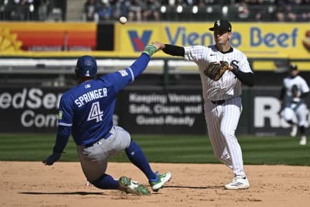 Chicago White Sox shortstop Tanner Murphy throws a double play after forcing out Toronto Blue Jays right fielder George Springer (4) during the fifth inning at Rate Field.