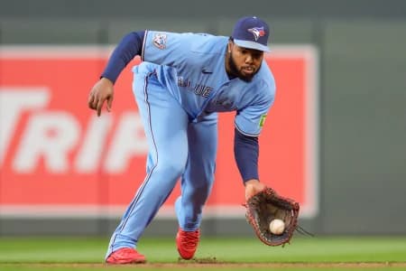 Toronto Blue Jays first baseman Vladimir Guerrero Jr. (27) fields a ground ball from Minnesota Twins designated hitter Josh Bell (56) in the sixth inning at Target Field.