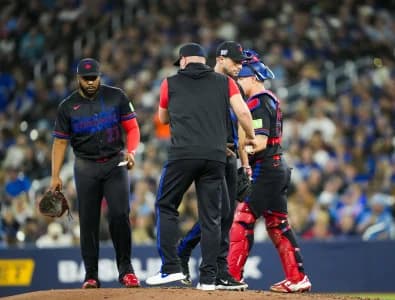 Toronto Blue Jays pitcher Max Scherzer (31) is relieved by manager John Schneider (14) during the third inning against the Cleveland Guardians at Rogers Centre.