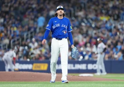 Toronto Blue Jays starting pitcher Kevin Gausman (34) walks towards the dugout against the Cleveland Guardians during the first inning at Rogers Centre.