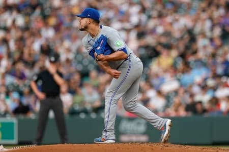Toronto Blue Jays starting pitcher Jose Berrios (17) throws to second for a pick off to end the third inning against the Colorado Rockies at Coors Field.