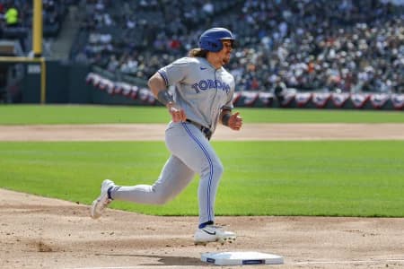 Toronto Blue Jays right fielder Addison Barger (47) runs to score against the Chicago White Sox during the second inning at Rate Field.