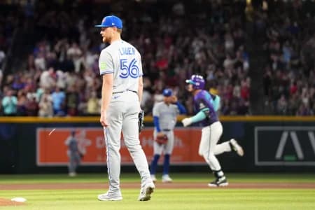 Toronto Blue Jays pitcher Eric Lauer (56) reacts after giving up a solo home run to Arizona Diamondbacks third baseman Nolan Arenado (28) during the fourth inning at Chase Field.