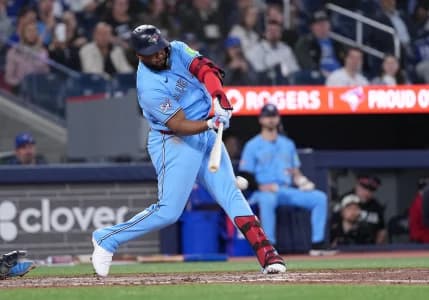Toronto Blue Jays first baseman Vladimir Guerrero Jr. (27) hits an RBI single against the Tampa Bay Rays during the seventh inning at Rogers Centre.