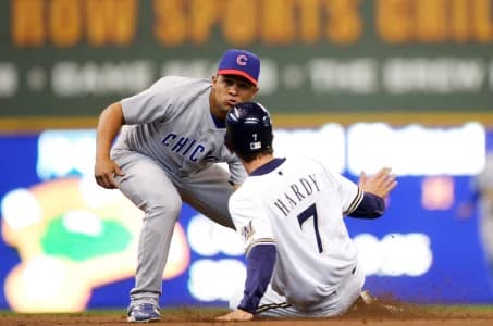 Chicago Cubs shortstop Cesar Izturis (3) tags out Milwaukee Brewers shortstop J.J. Hardy (7) completing a double-play during the fourth inning at Miller Park. The Cubs defeated the Brewers 6-3.