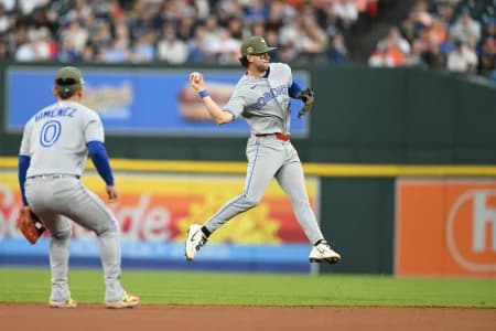 Toronto Blue Jays second baseman Ernie Clement (22) makes a jump throw to first base on a ground ball off the bat of Detroit Tigers catcher Dillon Dingler (not pictured) in the sixth inning at Comerica Park.