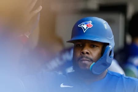 Toronto Blue Jays first baseman Vladimir Guerrero Jr. (27) receives congratulations from teammates after scoring tenth inning against the Detroit Tigers at Comerica Park.
