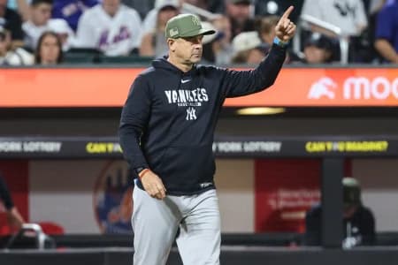 New York Yankees manager Aaron Boone (17) signals for a pitching change in the fifth inning against the New York Mets at Citi Field.