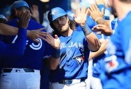 Toronto Blue Jays third baseman Addison Barger (47) celebrates after scoring during the fourth inning against the Atlanta Braves at TD Ballpark.