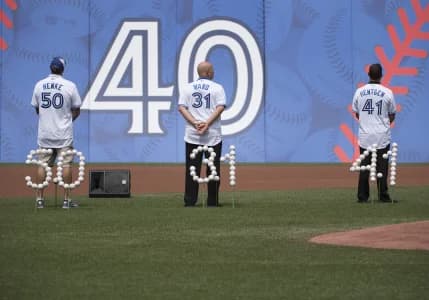 Former Toronto Blue Jays pitchers Tom Henke and Duane Ward and Pat Heineken watch the giant screen during the 40th Season Ceremonies prior to a game against the Houston Astros at Rogers Centre. The Toronto Blue Jays won 9-2.