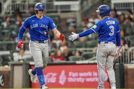 Toronto Blue Jays catcher Brandon Valenzuela (59) reacts with outfielder Myles Straw (3) after hitting a home run against the Atlanta Braves during the ninth inning at Truist Park.