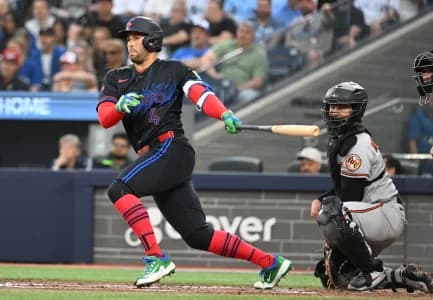 Toronto Blue Jays designated hitter George Springer (4) hits a single against the Baltimore Orioles in the third inning at Rogers Centre.