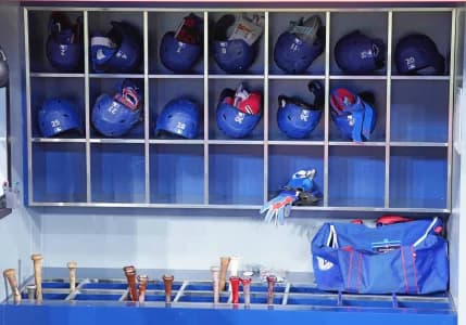 The Toronto Blue Jays Batting helmets and bats sit in the dugout during batting practice before a game against the Colorado Rockies at Rogers Centre.