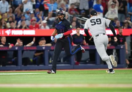 Toronto Blue Jays first baseman Vladimir Guerrero Jr. (27) runs to home plate scoring a run on a catcher Alejandro Kirk (30) (not pictured) an RBI single against the New York Yankees during the fifth inning at Rogers Centre.