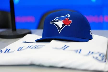 The baseball cap and jersey sit on the table before the press conference of Toronto Blue Jays Kazuma Okamoto (not pictured) at Rogers Centre.