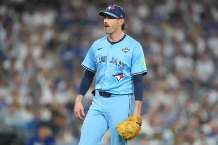 Toronto Blue Jays pitcher Shane Bieber (57) reacts in the third inning against the Los Angeles Dodgers during game four of the 2025 MLB World Series at Dodger Stadium. M