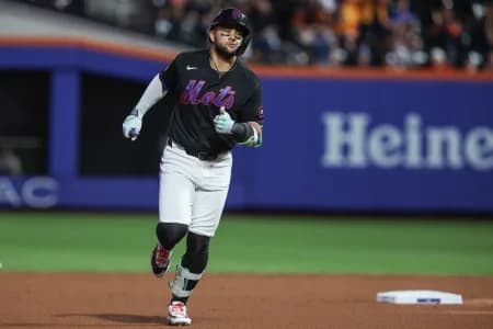 New York Mets shortstop Bo Bichette (19) hits a solo home run in the first inning against the Atlanta Braves at Citi Field.