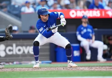 Toronto Blue Jays second baseman Ernie Clement (22) attempts a bunt and pops out against the New York Yankees during the eighth inning at Rogers Centre.