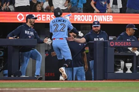 Toronto Blue Jays short stop Ernie Clement (22) celebrates a run with manager John Schneider (right) in the fourth inning against the New York Yankees at Rogers Centre.
