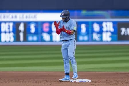 Toronto Blue Jays second baseman Santiago Espinal (5) celebrates after hitting a double against the Chicago Cubs during the sixth inning at Rogers Centre.