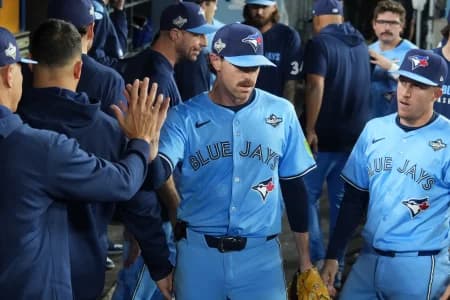 Toronto Blue Jays pitcher Shane Bieber (57) reacts in the dugout after being relieved in the sixth inning against the Los Angeles Dodgers during game four of the 2025 MLB World Series at Dodger Stadium