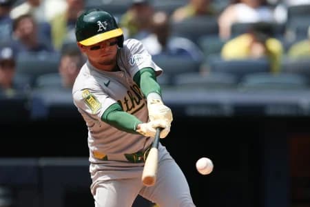 Athletics second base Luis Urias (17) singles during the fifth inning against the New York Yankees at Yankee Stadium.