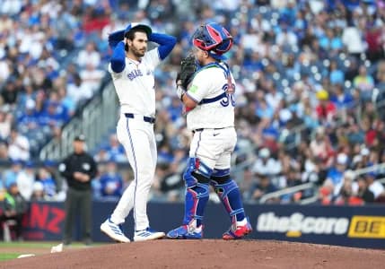 Toronto Blue Jays starting pitcher Dylan Cease (84) talks with catcher Alejandro Kirk (30) against the Houston Astros during the first inning at Rogers Centre.