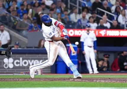 Toronto Blue Jays first baseman Vladimir Guerrero Jr. (27) hits a single against the Houston Astros during the eighth inning at Rogers Centre.