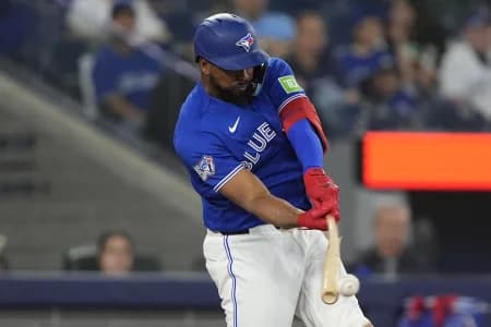 Toronto Blue Jays designated hitter Eloy Jimenez (74) hits a single against the Minnesota Twins during the eighth inning at Rogers Centre.