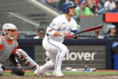 Toronto Blue Jays center fielder Daulton Varsho (5) hits a double against the Houston Astros in the fifth inning at Rogers Centre.