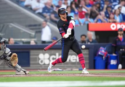 Toronto Blue Jays second baseman Ernie Clement (22) hits an in field single against the New York Yankees during the first inning at Rogers Centre.