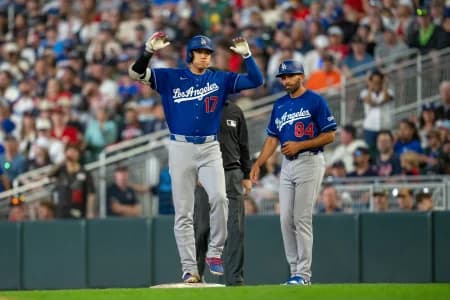 Los Angeles Dodgers starting pitcher Shohei Ohtani (17) celebrates hitting a single against the Minnesota Twins in the ninth inning at Target Field.
