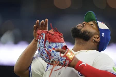 Toronto Blue Jays first baseman Vladimir Guerrero Jr. (27) sets up to catch a fly ball hit by Texas Rangers center fielder Wyatt Langford (not pictured) during the seventh inning at Rogers Centre.