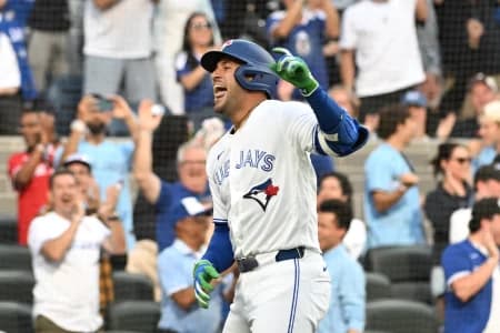 Toronto Blue Jays designated hitter George Springer (4) reacts after scoring a run on a triple and an error against the New York Mets in the first inning at Rogers Centre.