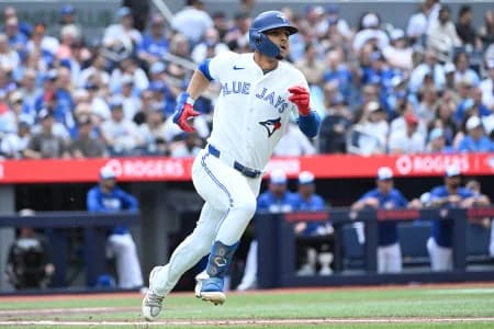 Toronto Blue Jays shortstop Andres Gimenez (0) runs the bases after hitting a double against the Houston Astros in the second inning at Rogers Centre.