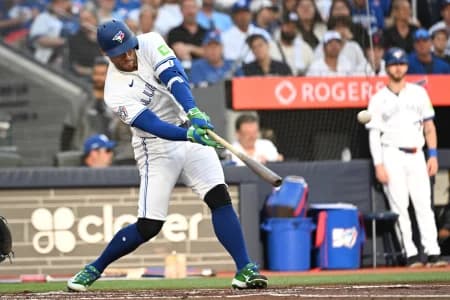 Toronto Blue Jays designated hitter George Springer (4) hits a triple that becomes an inside the park home run on an error against the New York Mets in the first inning at Rogers Centre.