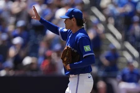 Toronto Blue Jays starting pitcher Shane Bieber (57) acknowledges the fans after getting his 1,000th career strike out during the fifth inning against the Texas Rangers at Rogers Centre.