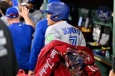 Toronto Blue Jays third baseman Kazuma Okamoto (7) celebrates a two run home against the Boston Red Sox during the seventh inning at Fenway Park.