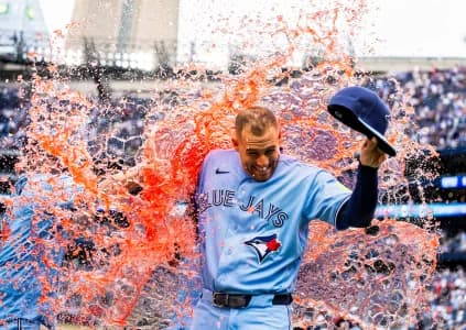 Toronto Blue Jays designated hitter George Springer (4) has orange liquid dumped on him after defeating the St. Louis Cardinals at Rogers Centre