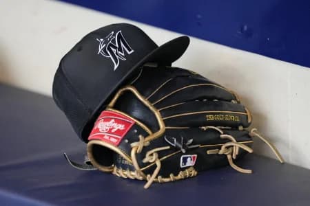 General view of a Miami Marlins hat and glove prior to the game against the Milwaukee Brewers at American Family Field