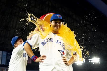 Toronto Blue Jays center fielder Brett Bateman (21) gets doused with a sports drink after defeating the Boston Red Sox at Rogers Centre.