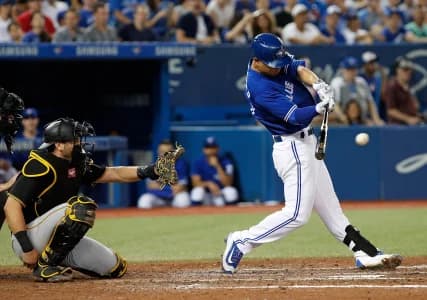 Toronto Blue Jays second baseman Rob Refsnyder (39) hits a single during the 6th inning against the Pittsburgh Pirates at the Rogers Centre. The Toronto Blue Jays beat the Pittsburgh Pirates 7-2.