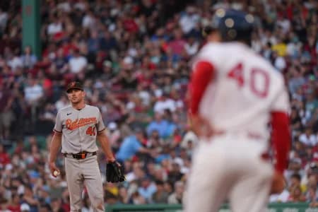 Baltimore Orioles pitcher Chris Bassitt (40) on the mound with the bases loaded against the Boston Red Sox in the third inning at Fenway Park