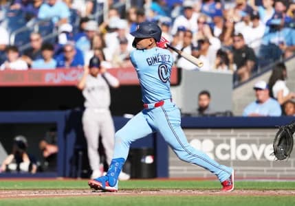 Toronto Blue Jays shortstop Andrés Giménez (0) hits a single against the New York Yankees during the eighth inning at Rogers Centre.