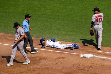 Toronto Blue Jays shortstop Andrés Giménez (0) lays on the infield after being called out at first base during the fifth inning at Rogers Centre.