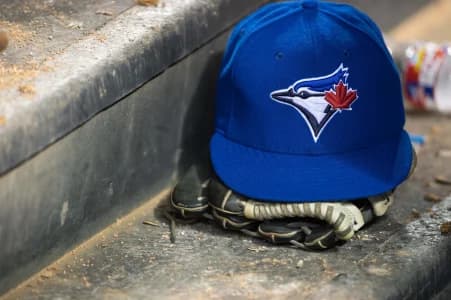 A view of a Toronto Blue Jays ball cap and logo during the game between the Texas Rangers and the Blue Jays at Globe Life Park in Arlington. The Blue Jays defeated the Texas Rangers 4-2.