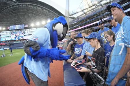 The Toronto Blue Jays mascot "Ace" interacts with fans before their game against the Kansas City Royals at Rogers Centre.