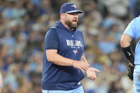 Toronto Blue Jays manager John Schneider visits the pitching mound during the eighth inning against the Kansas City Royals at Rogers Centre.