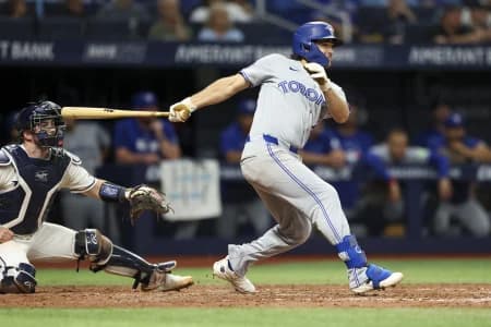 Toronto Blue Jays third baseman Josh Smith (9) hits a two-run home run against the Tampa Bay Rays in the seventh inning at Tropicana Field.